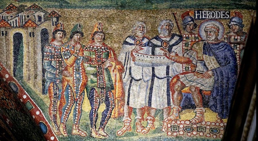 Triumphal arch mosaic labelled HERODES: three figures in eastern dress and pointed caps approach a seated haloed king attended by soldiers, with a walled city behind them.